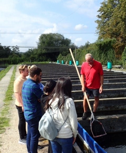 A group of people at Chalk Stream Trout farm